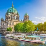 Beautiful-view-of-Berliner-Dom-Berlin-Cathedral-at-famous-Museumsinsel-Museum-Island-with-excursion-boat-on-Spree-river-in-beautiful-evening-light-at-sunset-Berlin-Germany-min