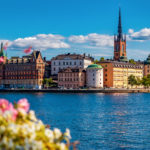 Panoramic view across Lake Malaren onto traditional gothic buildings in the old town, Gamla Stan in and Riddarholmen church, the burial church of Swedish monarchs in Stockholm, Sweden